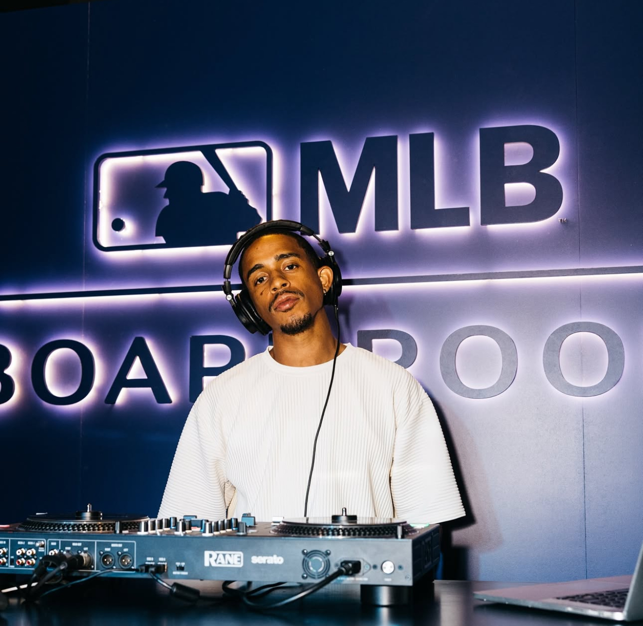Disc Jockey Jordy behind the decks at MLB Boardroom